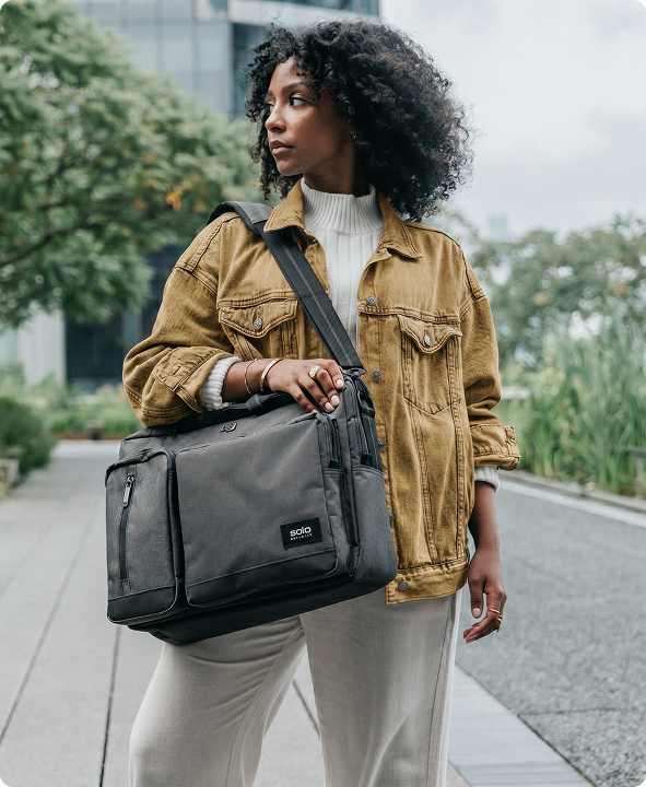 A Solo New York briefcase carried by hand